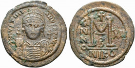 Justinian I (527-565). Æ 40 Nummi (40mm, 21.48g, 6h). Nicomedia, year 12 (538/9). Helmeted and cuirassed bust facing, holding globus cruciger and shie...
