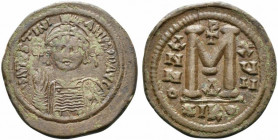 Justinian I (527-565). Æ 40 Nummi (35.5mm, 20.46g, 7h). Nicomedia, year 17 (543/4). Helmeted and cuirassed facing bust, holding globus cruciger and sh...