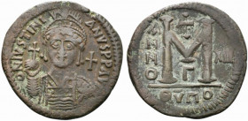 Justinian I (527-565). Æ 40 Nummi (38mm, 23.55g, 5h). Theoupolis (Antioch), year 13 (539-540). Helmeted, pearl-diademed and cuirassed bust facing, hol...