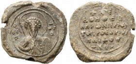 Byzantine Pb Seal, c. 11th century (31mm, 18.84g). Nimbate bust of St. Theodore facing, holding spear and shield. R/ Legend in six lines. VF