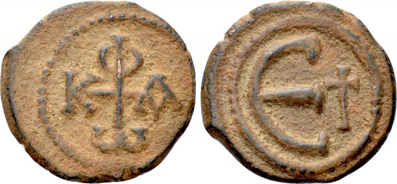 PHOCAS (602-610). Pentanummium. Antioch. 

Obv: Monogram.
Rev: Large Є; cross...
