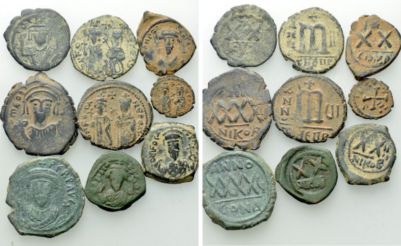 9 Byzantine Coins of Phocas. 

Obv: .
Rev: .

. 

Condition: See picture....