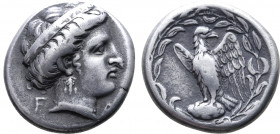 Elis, Olympia AR Stater. Hera mint, 111th Olympiad = 336 BC. Head of Hera to right, wearing pendant earring and stephane inscribed FAΛEIΩN; F-A across...