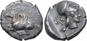 Corinthia, Corinth AR Stater. Circa 480 BC. Pegasos flying to left; archaic Ϙ below / Head of Athena to right, wearing Corinthian helmet, pendant earr...