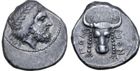 Crete, Polyrhenion AR Stater. 4th century BC. Charisthe, magistrate. Laureate head of Zeus to right / Head of sacrificial bull facing, with pendant fi...