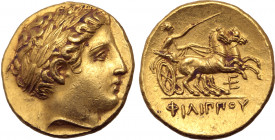 Kingdom of Macedon, Philip II AV Stater. Pella, circa 340/36-328 BC. Laureate head of Apollo to right / Charioteer, holding kentron and reins, driving...