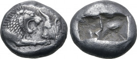 Kingdom of Lydia, Kroisos AR Siglos. Sardes, circa 561-564 BC. Confronted foreparts of lion to right and bull to left / Two incuse square punches of u...