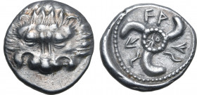 Dynasts of Lykia, Vekhssere II AR Third Stater. Zagaba or Tymnessos mint, circa 410-380 BC. Facing lion's scalp / Triskeles, with monogram in central ...