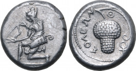 Cilicia, Soloi AR Stater. Circa 440-410 BC. Amazon kneeling to left, nude to the waist, wearing bonnet and with bowcase at hip, stringing bow / Grape ...