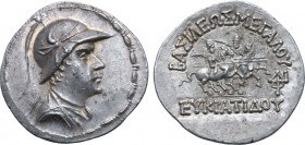 Greco-Baktrian Kingdom, Eukratides I Megas AR Tetradrachm. Circa 170-145 BC. Diademed and draped bust to right, wearing crested helmet adorned with bu...