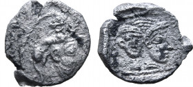 Philistia (Palestine), uncertain mint AR Obol. Circa 450-333 BC. Bearded male head to right, lion atop head to right (as headdress), head reverted wit...