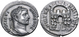 Diocletian AR Argenteus. Siscia, AD 294. DIOCLETIANVS AVG, laureate head to right / VIRTVS MILITVM, four tetrarchs sacrificing over tripod before city...