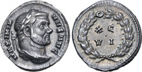 Maximian AR Argenteus. Carthage, AD 300. MAXIMIANVS AVG, laureate bust to right / XC VI in two lines surrounded by laurel wreath, pellet in centre. RI...