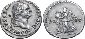 Divus Vespasian AR Denarius. Rome, AD 80-81. DIVVS AVG[VSTV]S VESPASIANVS•, laureate head to right / Victory standing to left, placing shield on troph...