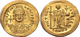 Justinian I AV Solidus. Constantinople, AD 538-545. D N IVSTINIANVS P P AVC, helmeted and cuirassed bust facing, holding globus cruciger and shield de...
