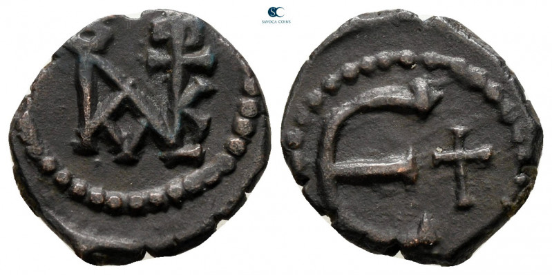 Justin II AD 565-578. Theoupolis (Antioch)
Pentanummium Æ

14 mm, 1,66 g

...