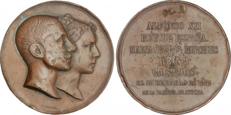 Medalla Boda Real. 23 Enero 1878. Anv.: Bustos sobrepuestos a derecha. Rev.: Ley...