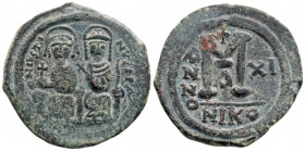 Byzantine
JUSTIN II. (565-578 AD)Nicomedia 
AE Follis (30,3 mm, 11,36 gm)
Obv: Facing, crowned busts of Justin and Sophia on double throne, he holds g...