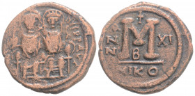 Byzantine
Justin II, with Sophia, (565-578 AD) Nicomedia
AE Follis (29,3 mm, 11.62 g) 
Obv: D N IVSTINVS P P AVG Justin II, holding globus cruciger in...