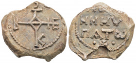 Byzantine Lead Seal ( 7th- 8th century)
Obv: Cruciform monogram 
Rev: three lines of text. Pearl border.
(12,77 gr, 28,7 mm diameter)