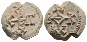 Byzantine Lead Seal ( 7-8 th centuries)
Obv: Cruciform monogram 
Rev: Cruciform monogram 
(15,71 gr, 23,7 mm diameter)