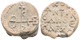 Byzantine Lead Seal ( 8th century)
Obv: Cruciform monogram 
Rev: Circular legend. 3 (three) lines of text.
(15,71 gr, 23,7 mm diameter)