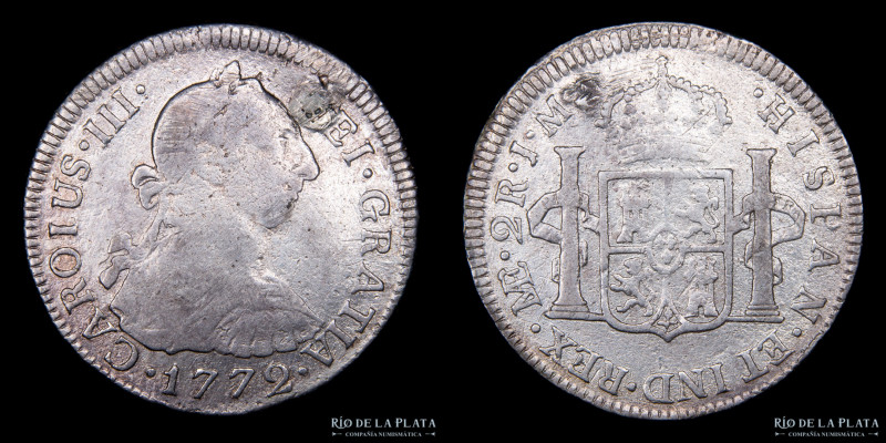 Lima. Carlos III. 2 Reales 1772 JM. CAROIUS. Por aparente desperfecto de cuño en...