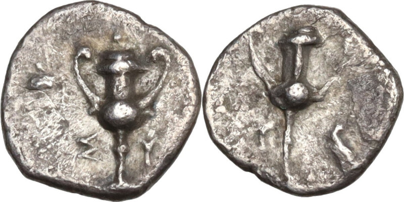 Greek Italy. Southern Apulia, Tarentum. AR Obol, 280-228 BC. Obv. Kantharos; aro...