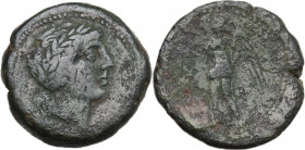 Sicily. Messana. The Mamertinoi. AE Trichalkon, c. 220-200 BC. Obv. Head of Apollo right, laureate. Rev. Nike standing left, holding wreath and palm. ...