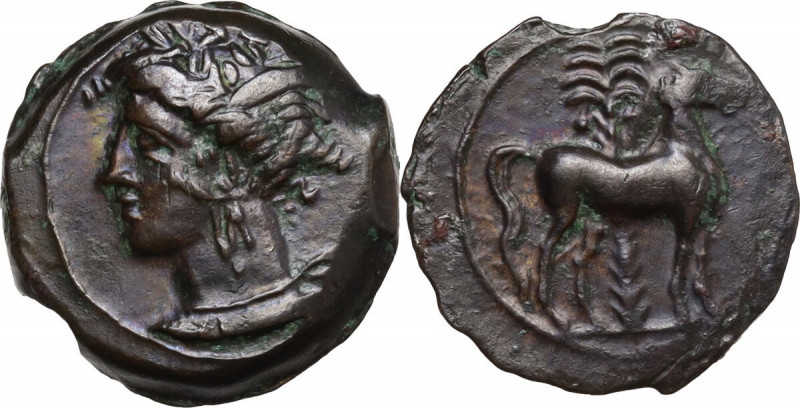 Punic Sardinia. AE 16.5 mm. c. 360-330 BC, uncertain mint. Obv. Wreathed head of...