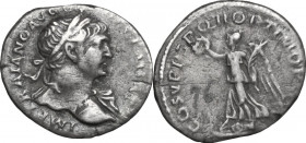 Trajan (98-117). AR Denarius, 103-111. Obv. Bust right, laureate, draped on left shoulder. Rev. Victory standing left over round and oblong shield, ho...