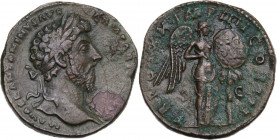 Marcus Aurelius (161-180). AE Sestertius, 166 AD. Obv. Laureate head right. Rev. Victory standing facing, head right, holding palm frond and placing s...