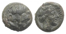 Bruttium, Rhegion, c. 350-270 BC. Æ (10mm, 1.81g, 6h). Facing lion's scalp. R/ Laureate head of Apollo. HNItaly 2524. Green patina, near VF