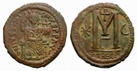 Justinian I (527-565). Æ 40 Nummi (32mm, 17.35g, 6h). Theoupolis (Antioch), c. 529-533. Justinian seated facing on throne, holding sceptre and globus ...
