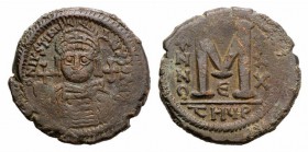 Justinian I (527-565). Æ 40 Nummi (34mm, 20.31g, 5h). Antioch, year 30 (556/7). Facing helmed and cuirassed bust, holding globus cruiciger. R/ Large M...