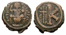 Justinian I (527-565). Æ 20 Nummi (25mm, 9.76g, 12h). Theoupolis (Antioch). Justinian enthroned facing, holding cross on globe and long sceptre. R/ La...