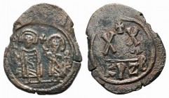 Phocas (602-610). Æ 20 Nummi (28mm, 6.28g, 12h). Cyzicus, 602/3. Full-length figures of Phocas and Leontia standing facing, holding globus cruciger an...