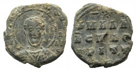 Byzantine Pb Seal, c. 7th-12th century (22mm, 5.77g, 12h). Facing bust of saint, nimbate. R/ Legend in four lines. VF
