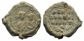 Byzantine Pb Seal, c. 7th-12th century (26mm, 13.71g, 12h). Two busts facing. R/ Legend in three lines. Good Fine