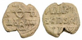 Byzantine Pb Seal, c. 7th-12th century (24mm, 14.42g, 12h). Legend in three lines. R/ Cruciform monogram. VF