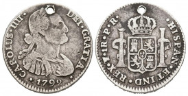 CARLOS IV (1788-1808). 1 Real (Ar. 3,24g/21mm). 1799. Potosí PR. (Cal-201-463). Primer busto. MBC-. Agujero a las 12. Escasa.