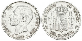 ALFONSO XII (1874-1885). 1 Peseta. (Ar. 4,90/23mm). 1882 * 18-82. Madrid MSM. (Cal-2019-20). BC+. Escasa.