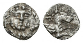 ASIA MINOR, Uncertain. 5th century BC. AR 0.69gr. 9.9mm.
Gorgoneion / Forepart of dog or wolf right within incuse square.