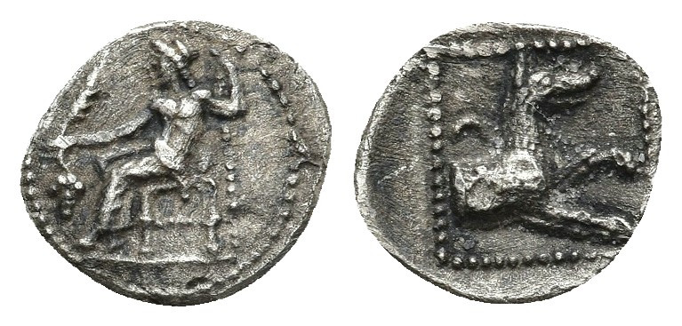LYCAONIA. Laranda. Obol (Circa 324/3 BC). 0.61.gr. 10.9mm.
Obv: Baal seated lef...