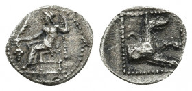 LYCAONIA. Laranda. Obol (Circa 324/3 BC). 0.61.gr. 10.9mm.
Obv: Baal seated left on throne, holding grain ear, grape bunch and sceptre. Rev: Forepart...
