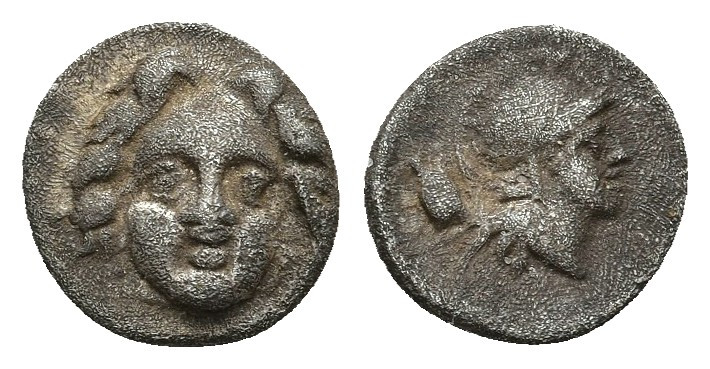 Pisidia, Selge AR Obol. 350-300 BC. 0.92gr. 10.2mm.
Facing gorgoneion / Helmete...