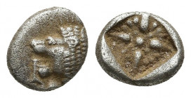 Ionia. Miletos circa 500 BC. Diobol AR 1.1gr. 9.4mm.
Forepart of a lion right, head turned back to left / Stellate design within square incuse.