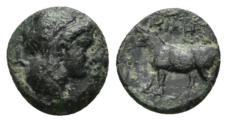 Ionia Uncertain (?) 1.24gr. 11.4mm.
Laureate head of Apollo to right. bull walk...