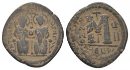 Byzantine
 Justin II, with Sophia. 565-578. Æ follis. Theoupolis (Antioch) mint, 3rd officina. Dated RY 7 (571/572). Justin and Sophia seated facing o...