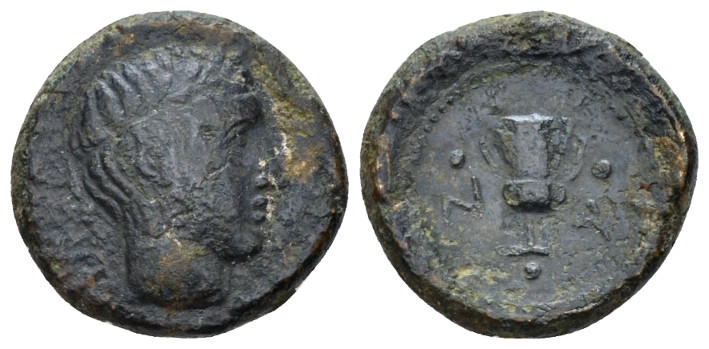 Sicily, Naxos Trias circa 410-403, Æ 15.00 mm., 3.80 g.
Wreathed young male hea...